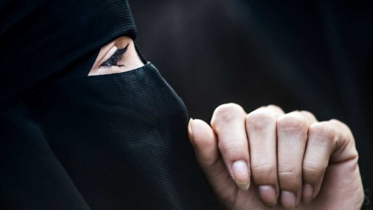 A protestor wears a niqab during a demonstration against a full-face veil ban in Vienna, Austria, 01 October 2017. The new law bans full-face veils in public places from 01 October 2017 on and says faces must be visible from the hairline to the chin. It b