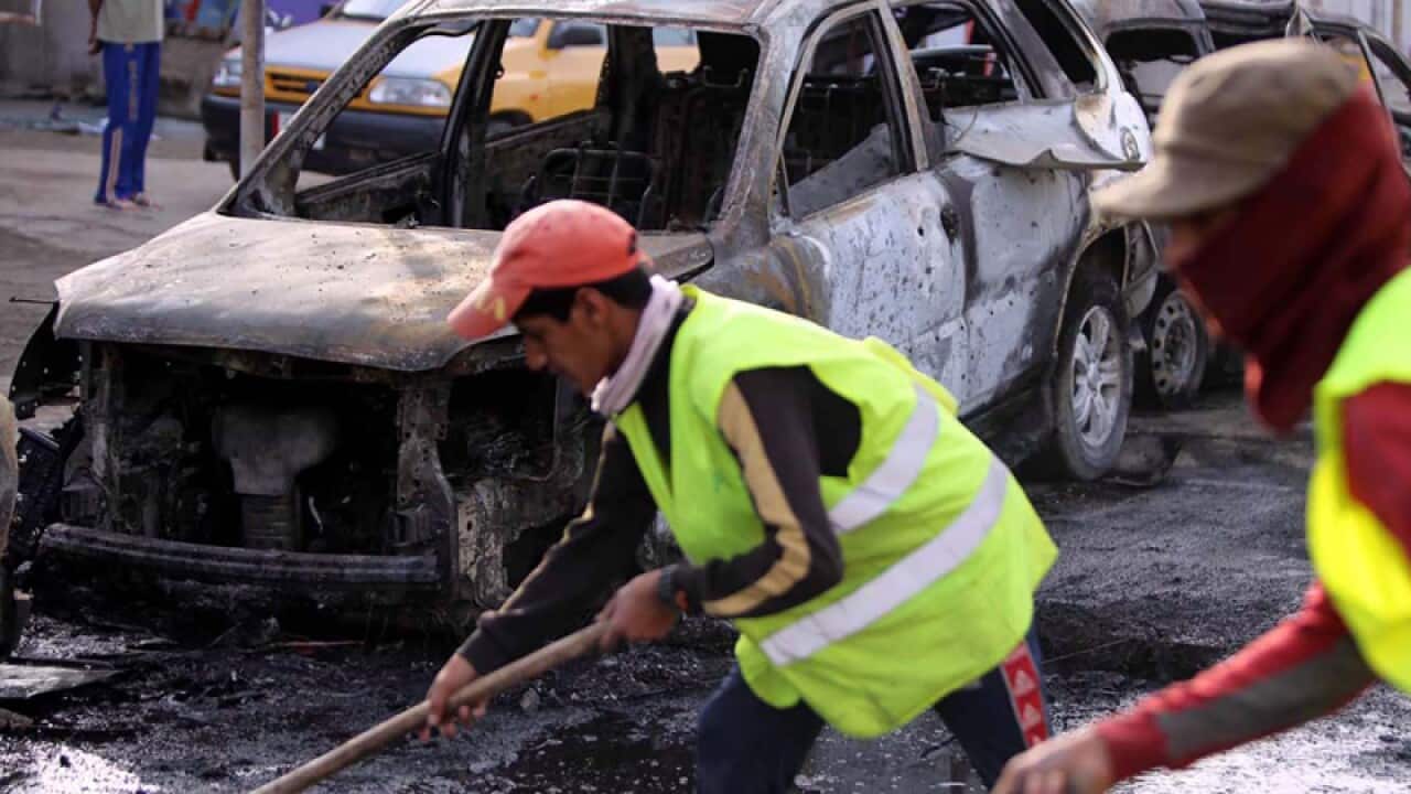 The site of a car bomb attack in Baghdad, Iraq