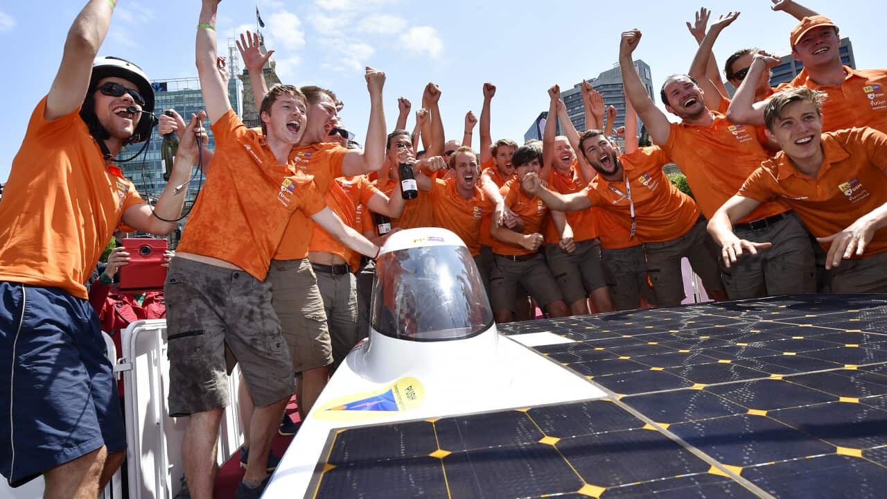 Nuon solar team from Holland celebrate after crossing the line in Adelaide to win the World solar challenge