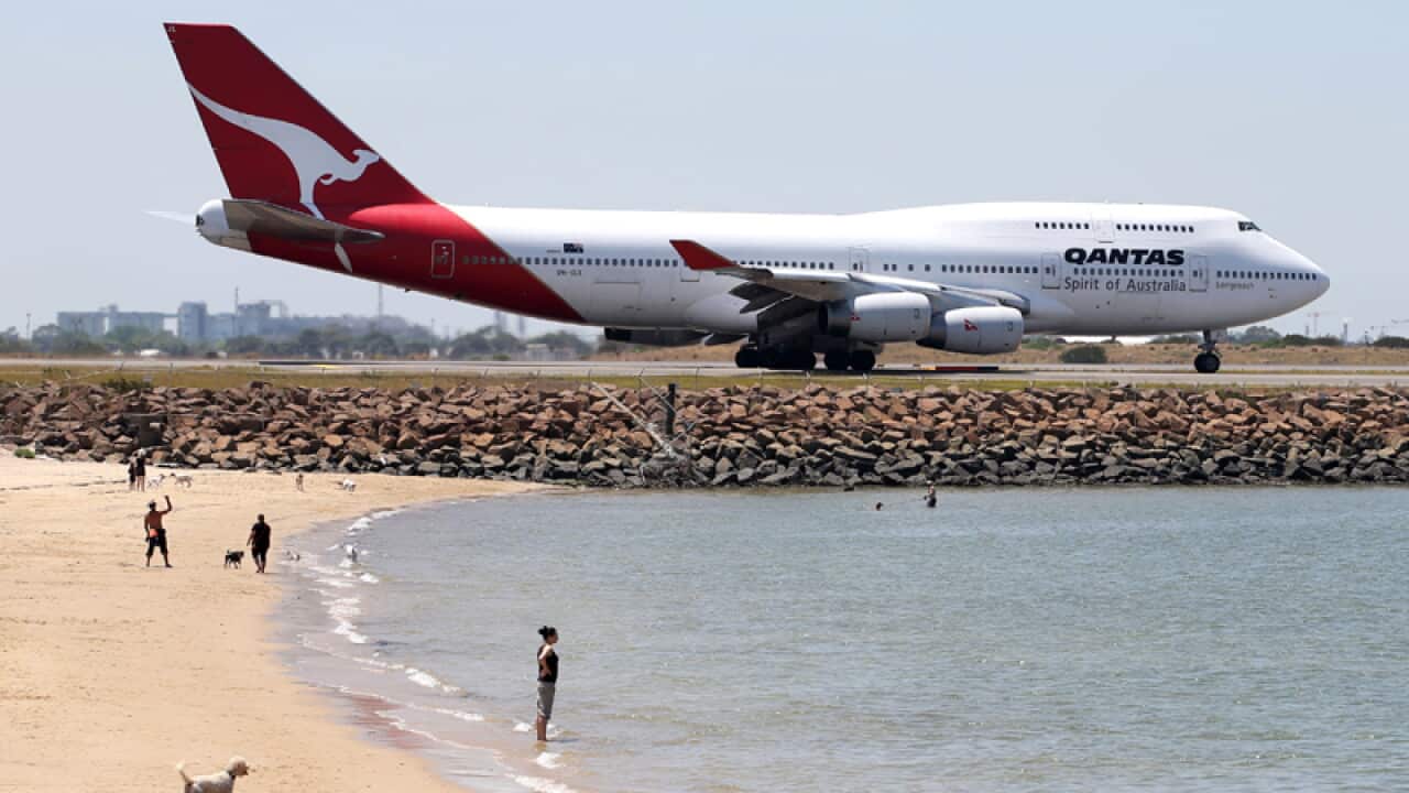 A Qantas plane taxis on the runway in Sydney