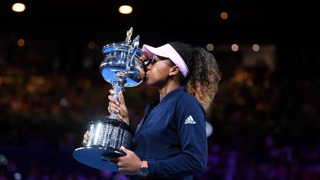 Naomi Osaka of Japan during the presentation of the winner's trophy,