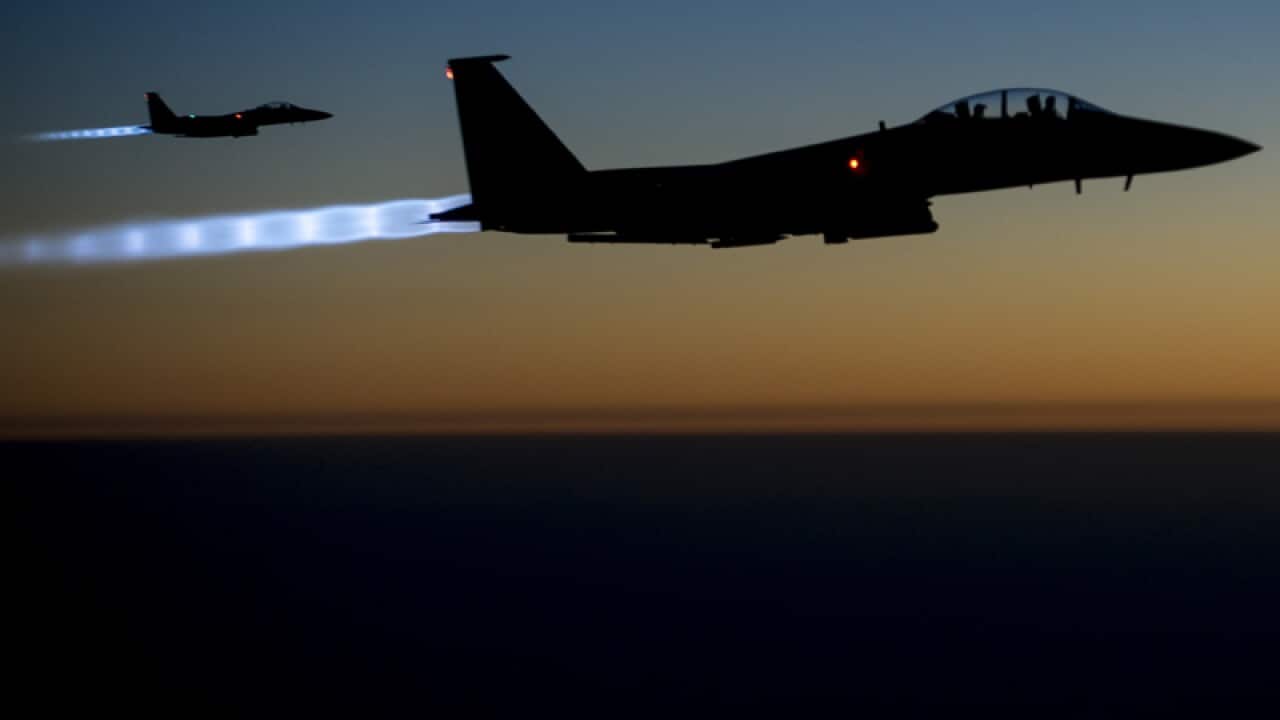 A pair of U.S. F-15E Strike Eagle fly over northern Iraq