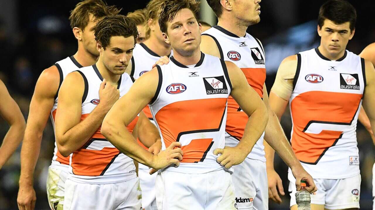Toby Greene of the Giants (centre) and team mates