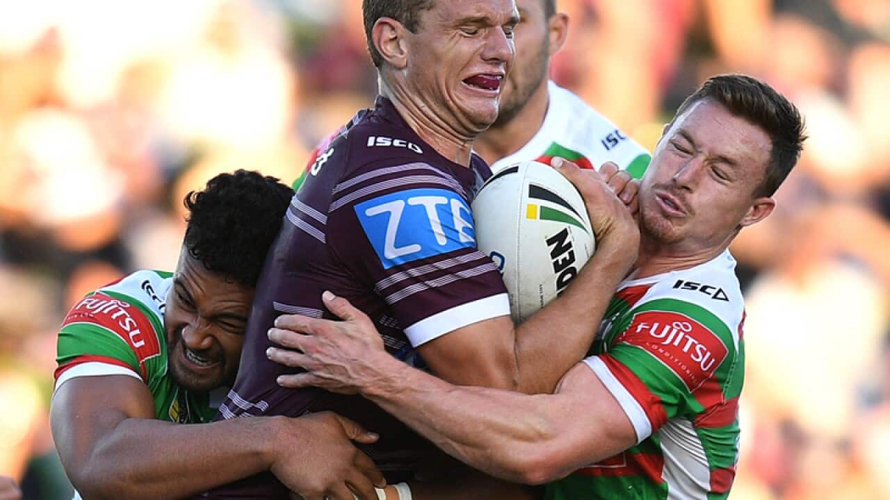 Tom Trbojevic of the Sea Eagles is tackled by Zane Musgrove