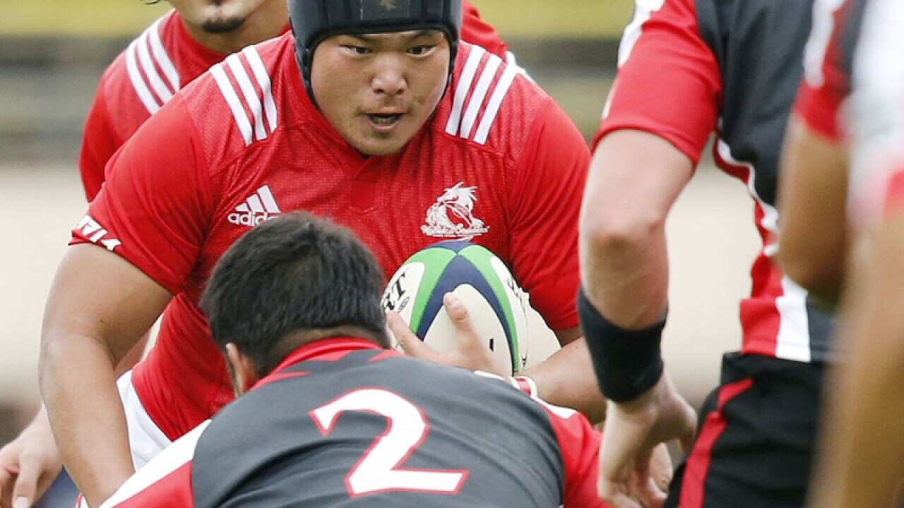 Hiroshi Yamashita runs with the ball