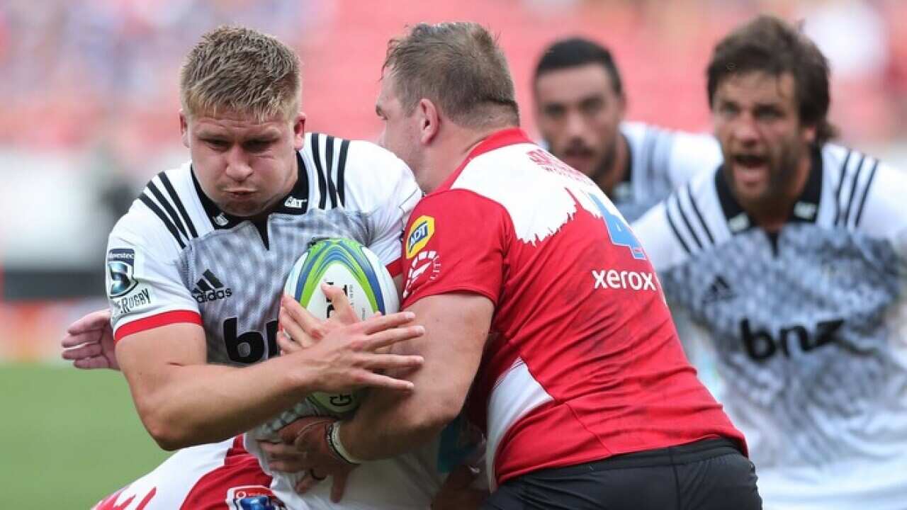 Jack Goodhue of the Crusaders tackled by Andries Ferreira of the Lions during their 2018 Super Rugby match on 1 April