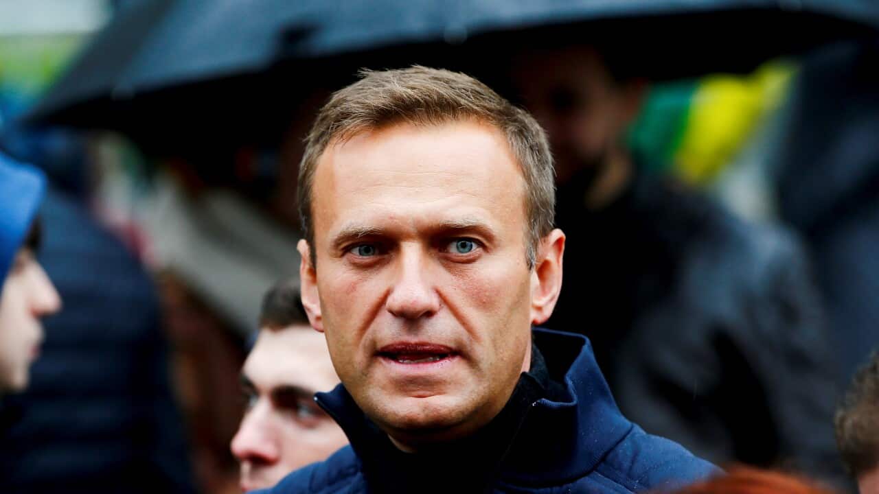 A man wearing a blue jacket