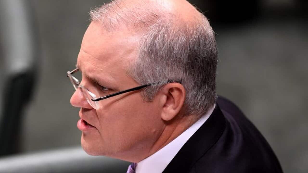 Australian Federal Treasurer Scott Morrison speaks at the dispatch box during the delivery of the 2017-18 Federal Budget in the House of Representatives at Parliament House in Canberra, Tuesday, May 9, 2017. (AAP Image/Lukas Coch) NO ARCHIVING