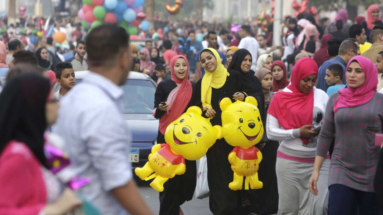 Egyptians celebrate Eid al-Fitr, marking the end of the Muslim holy month of Ramadan in Cairo (AAP)