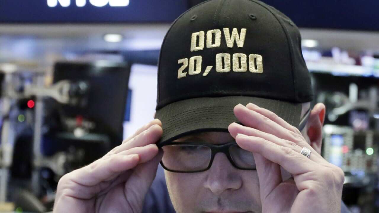Specialist Mario Picone adjusts his Dow 20,000 cap