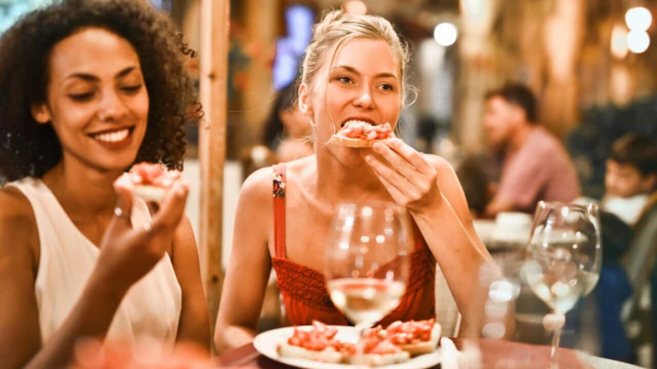 Women eating bruschetta