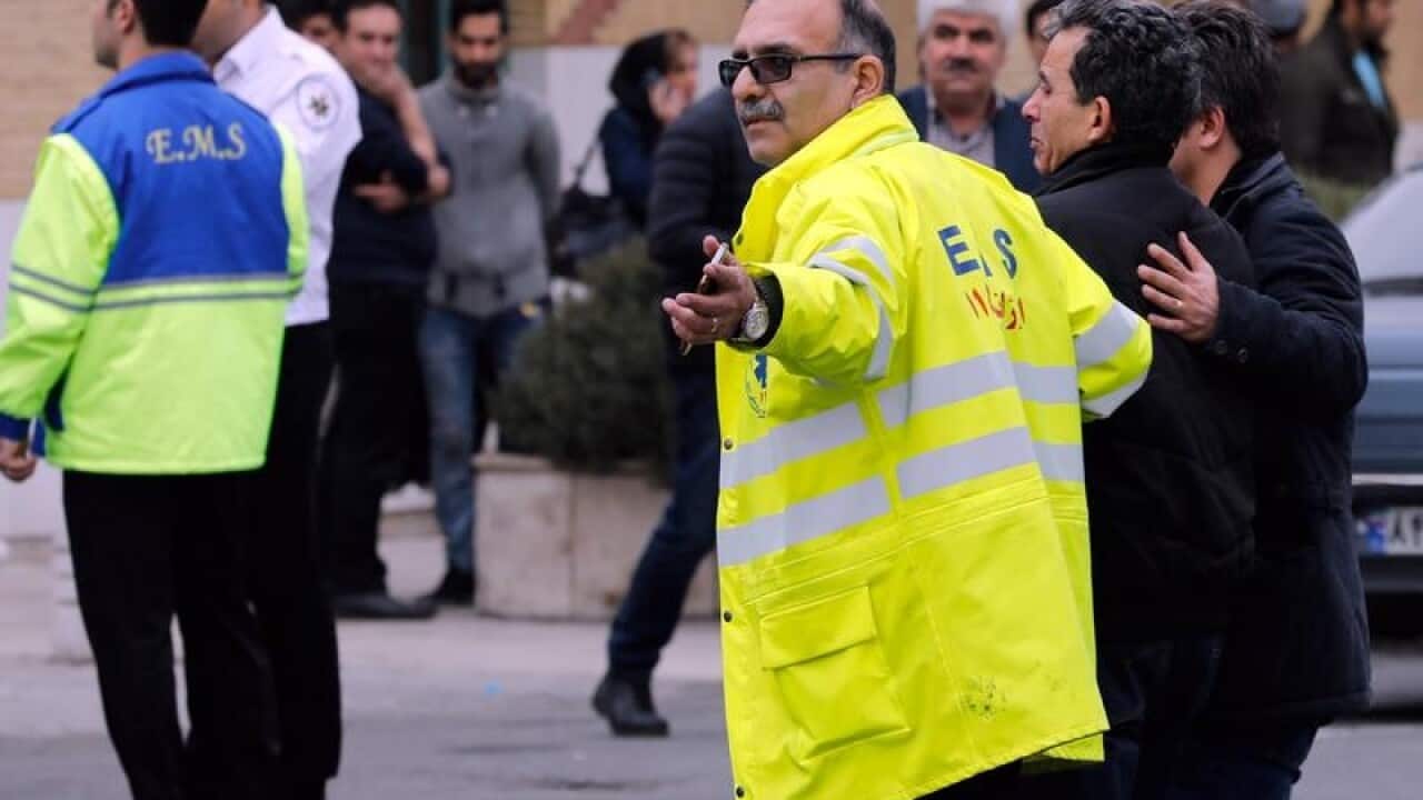 Emergency staff aid relatives of passengers on the Iranian flight