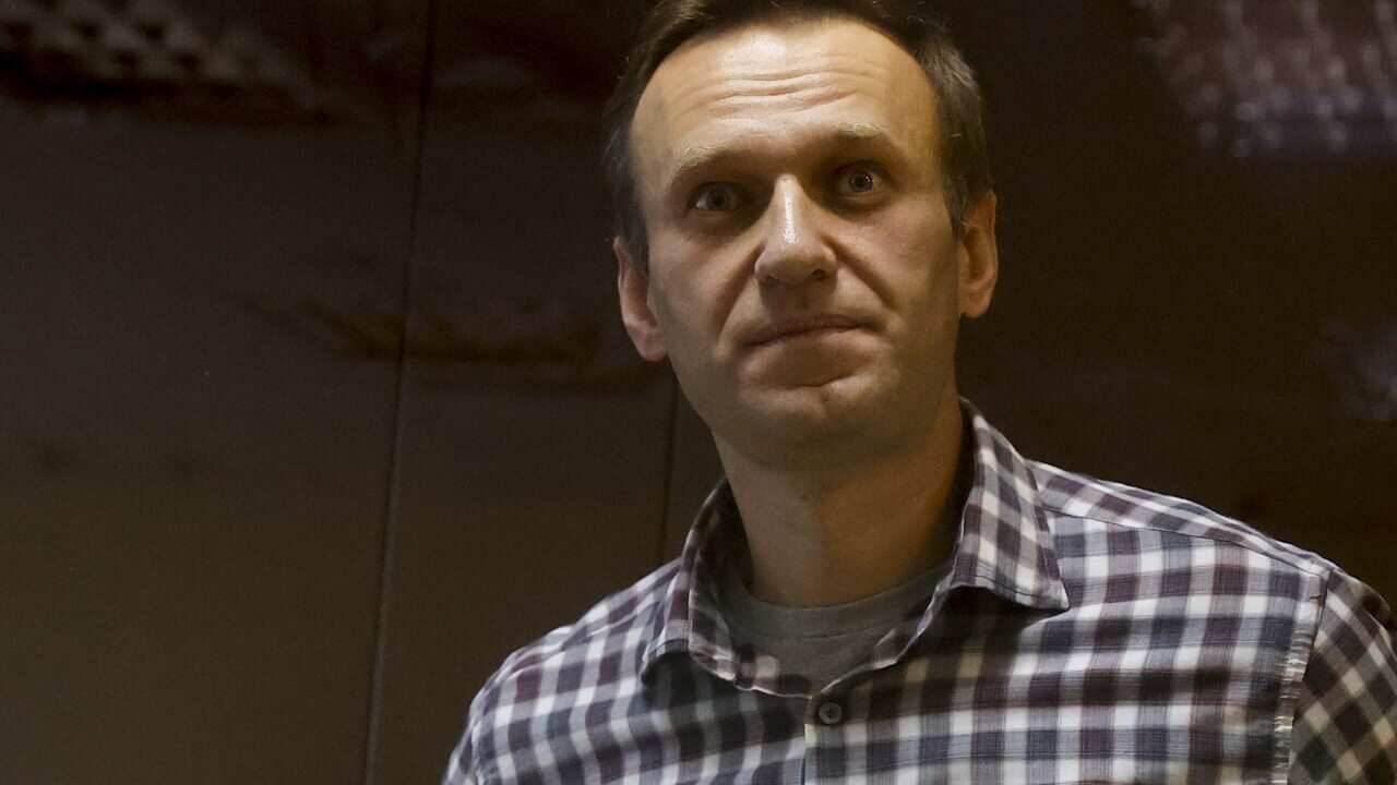 Alexei Navalny stands inside a glass cell during a court hearing at the Babushkinsky district court in Moscow, Russia on 20 February, 2021.
