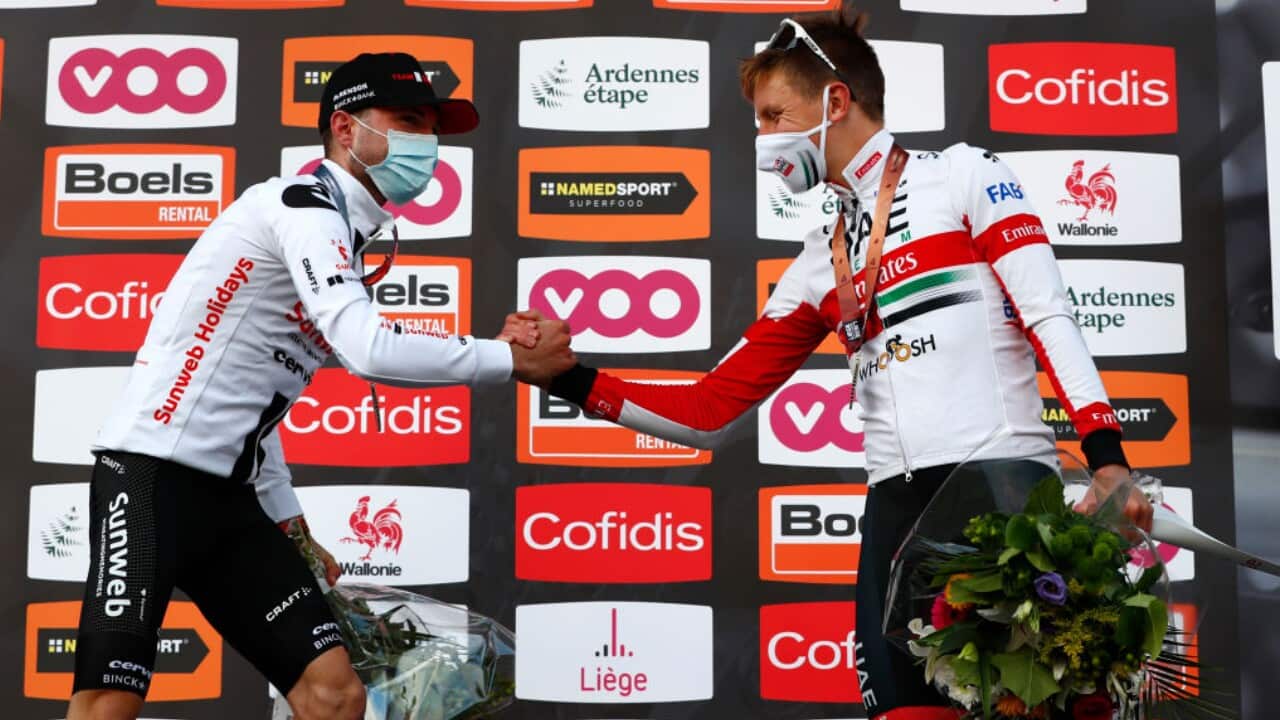 Marc Hirschi and Tadej Pogacar congratulate one another at the 2020 Liege-Bastogne-Liege