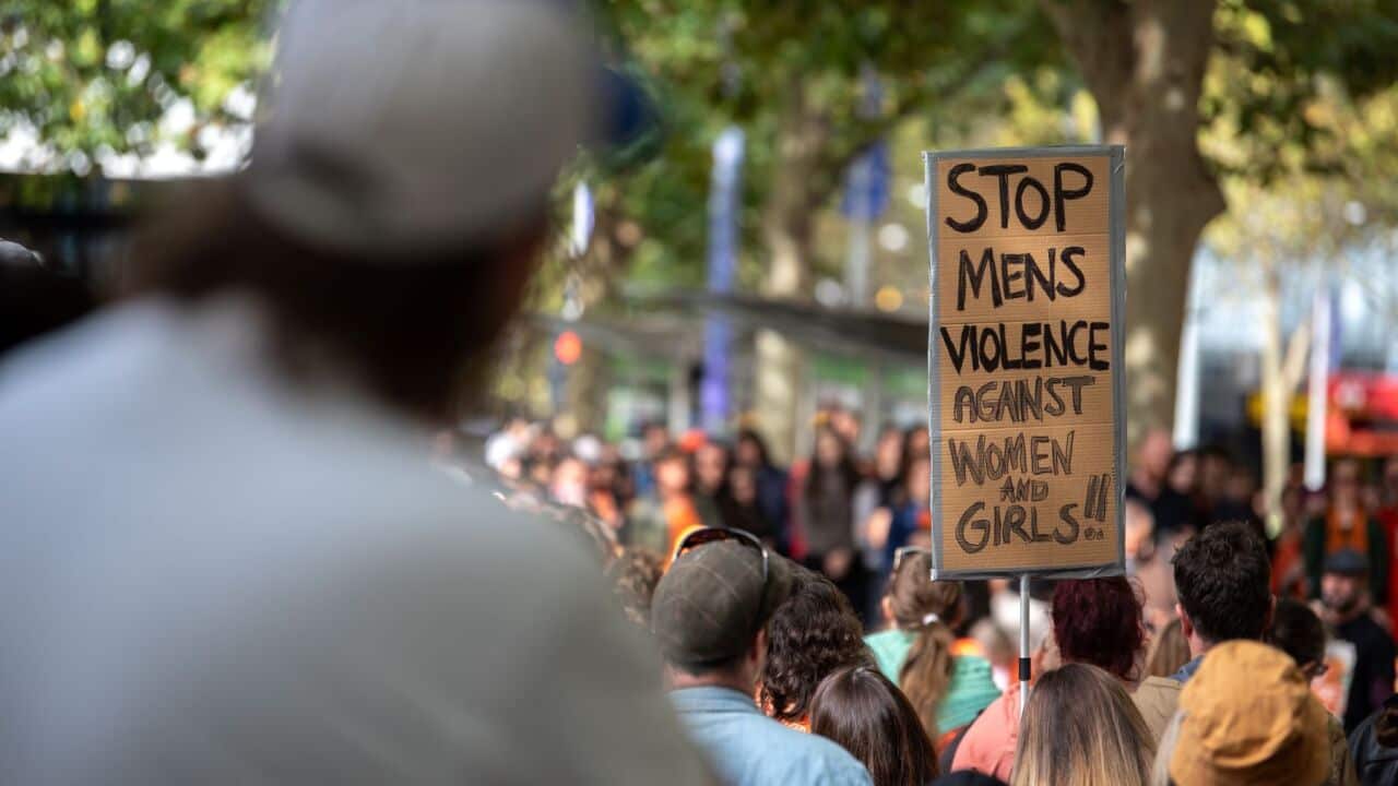 A sign reads 'Stop Men's Violence Against Women and Girls' during a rally for Isla Bell at the State Library of Victoria in Melbourne, Saturday, May 16, 2026 (AAP Image-Jay Kogler) .jpg