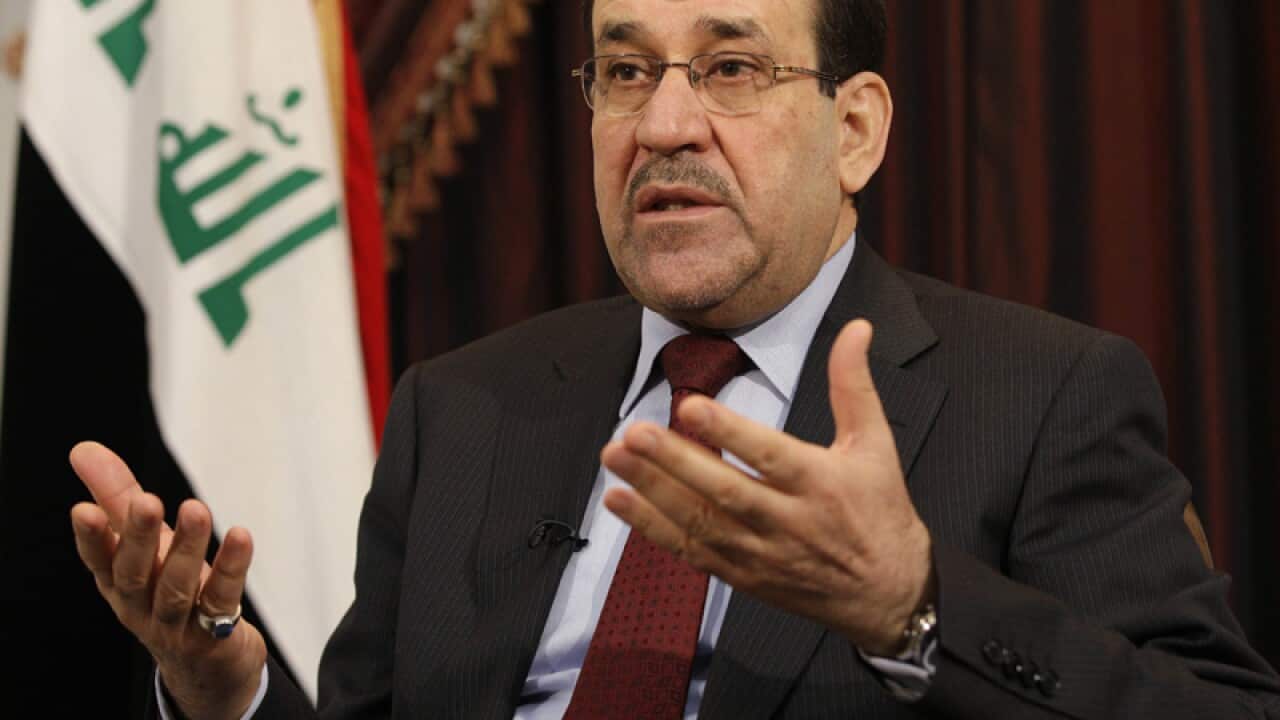 Nouri al-Maliki speaks during an interview.