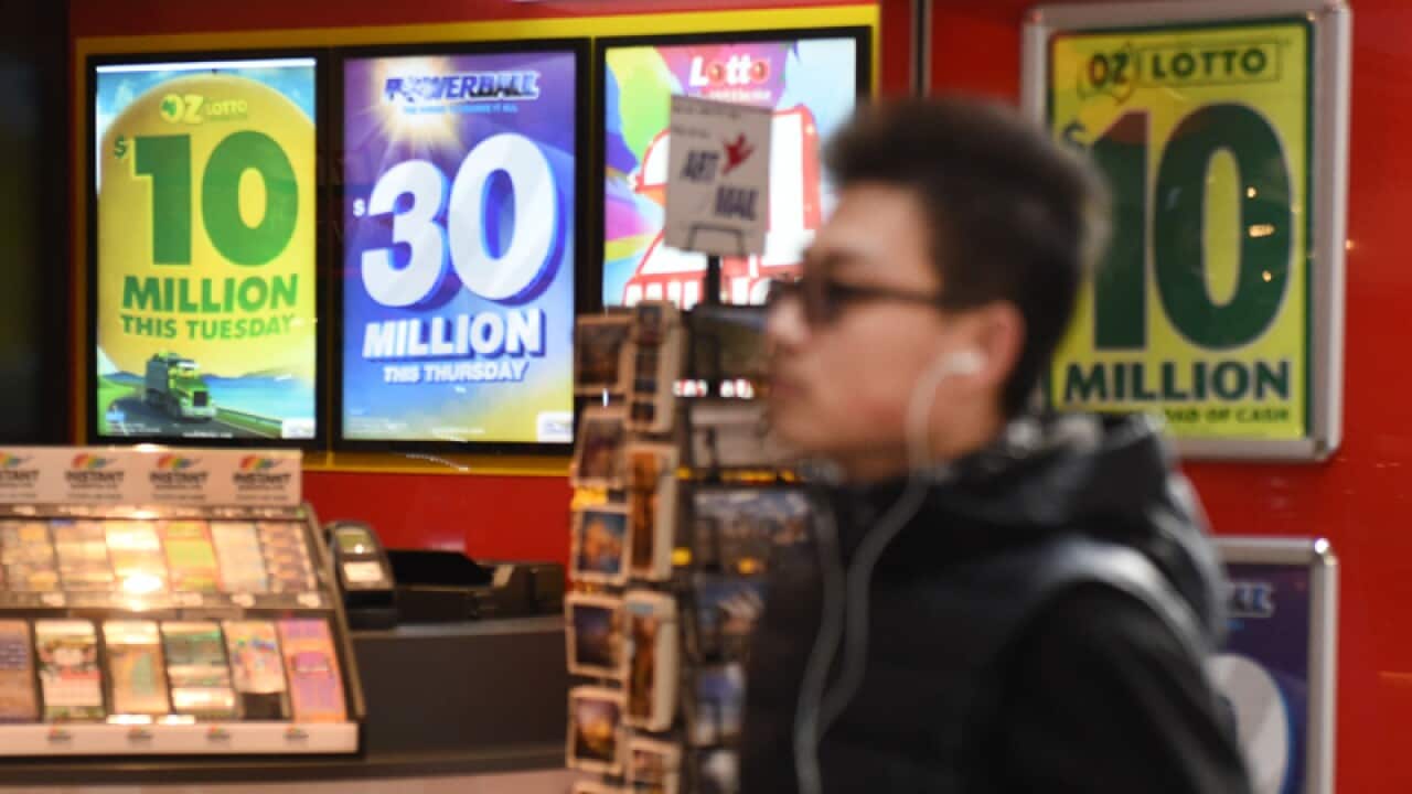Signs for lotteries jackpots at a newsagency