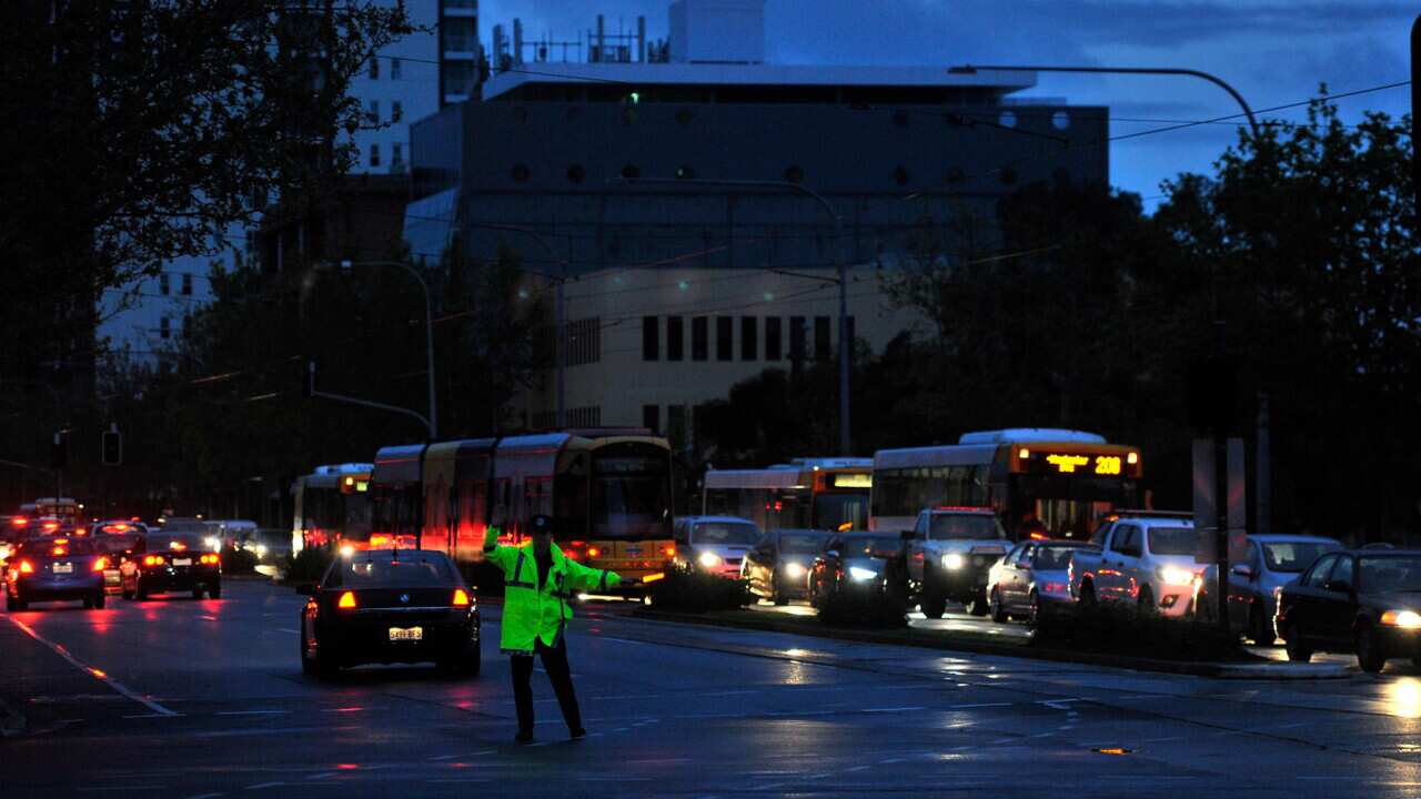 Police direct traffic around the CBD in Adelaide after the power network stopped working in 2016