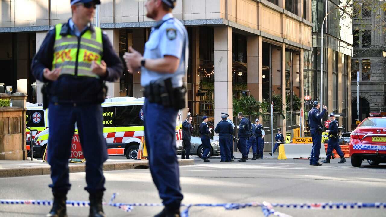 Police keep watch following the stabbing incident in Sydney's CBD.