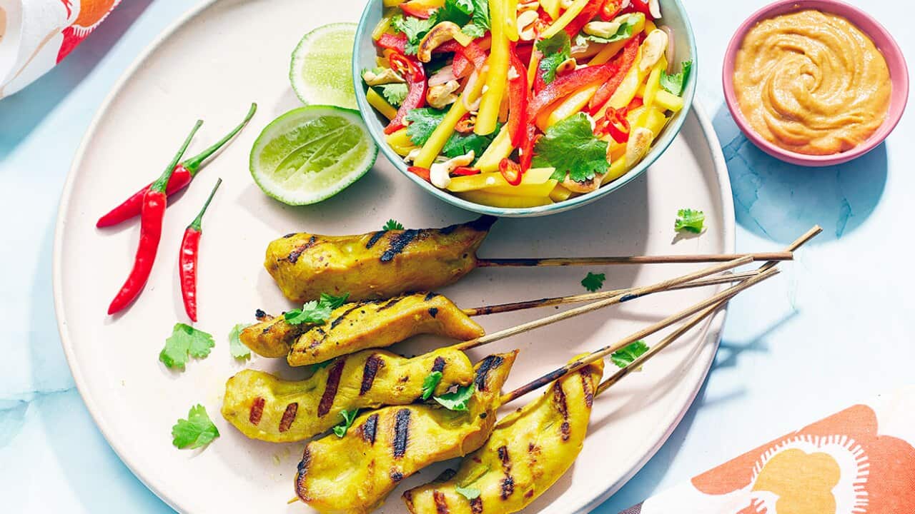 Chicken satay with cashew sauce and mango salad