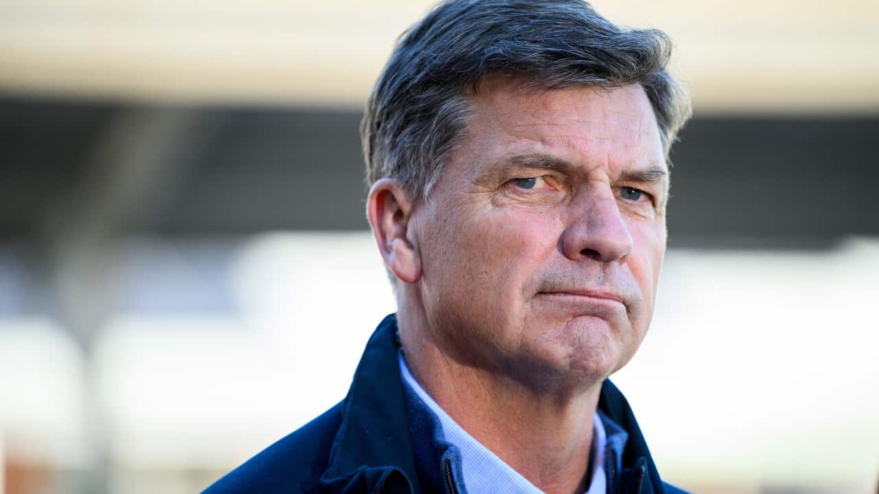 Image of a man looking serious.