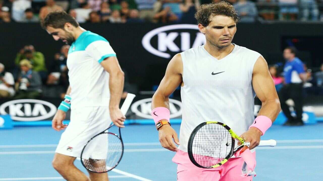 Marin Cilic (left) reached the semifinals after Rafael Nadal´s unexpected retirement
