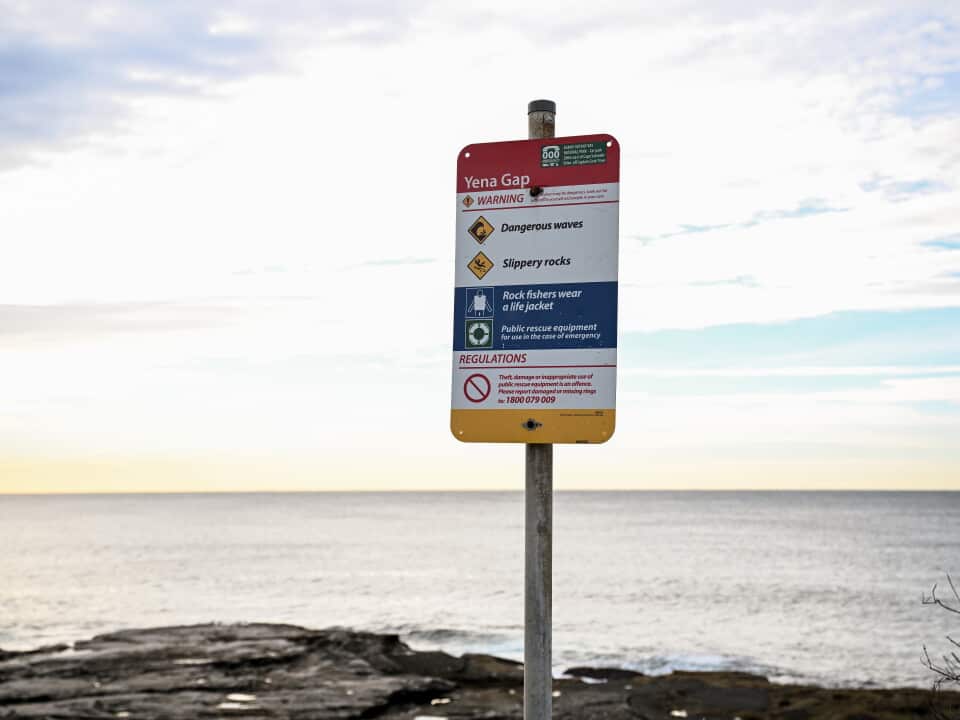 A sign displays a warning in Kurnell, NSW after drowning deaths
