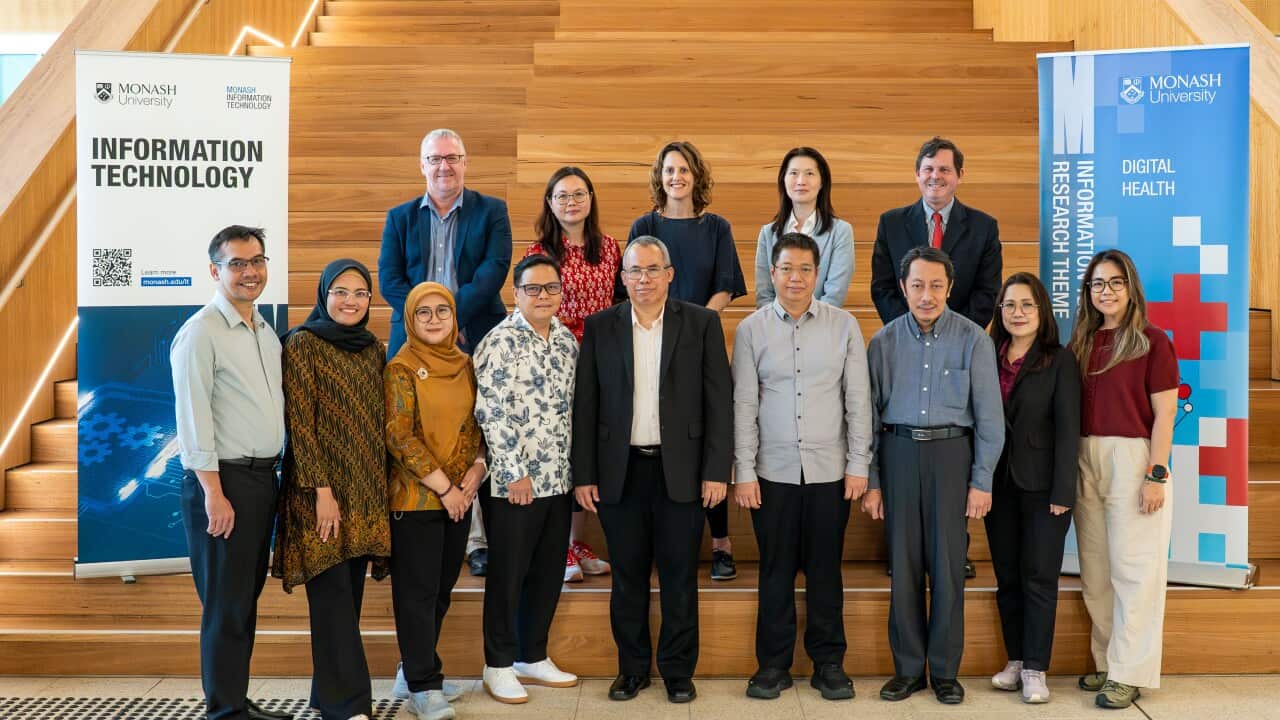 The Monash University research team with the nine senior Indonesian health professionals involved in developing the VDHIC.