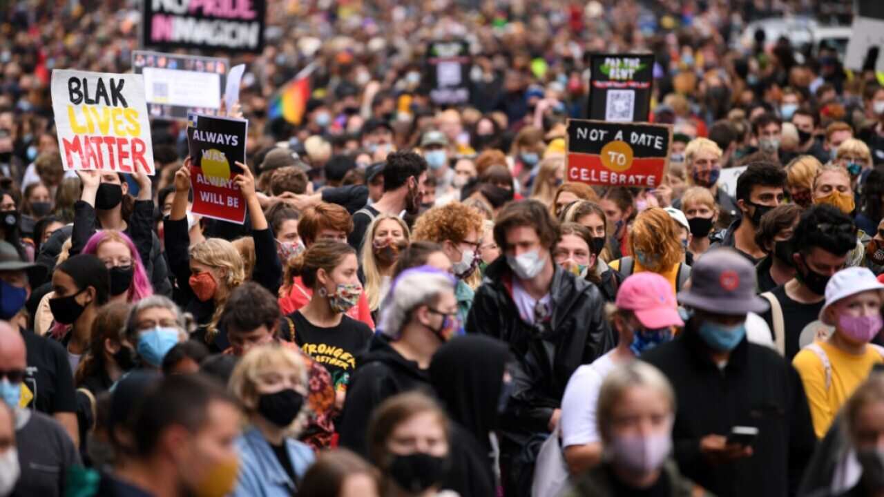 Protesters are seen during an Invasion Day rally in Melbourne.