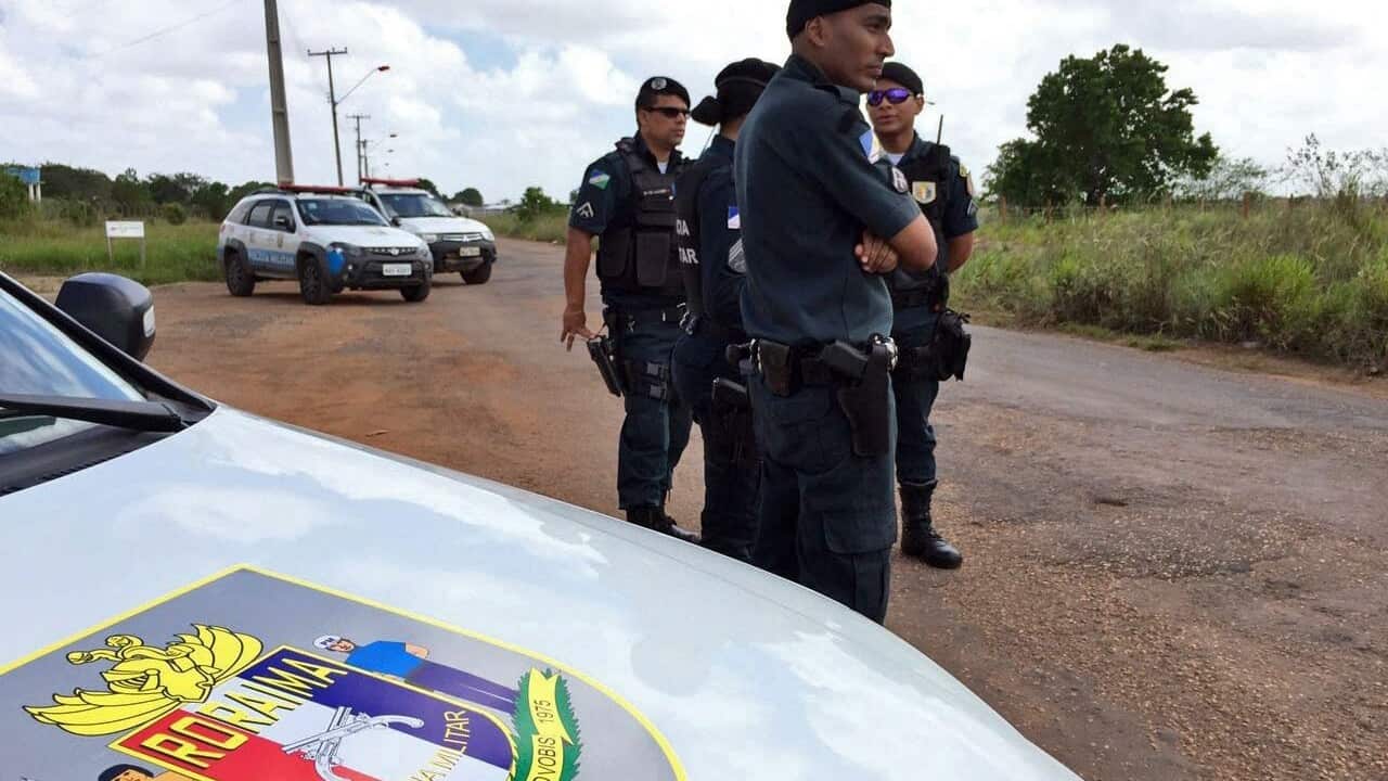Police officers stand guard outside the Agricultural Penitentiary of Monte Cristo prison in Boa Vista, Roraima, Brazil, 06 January 2017.