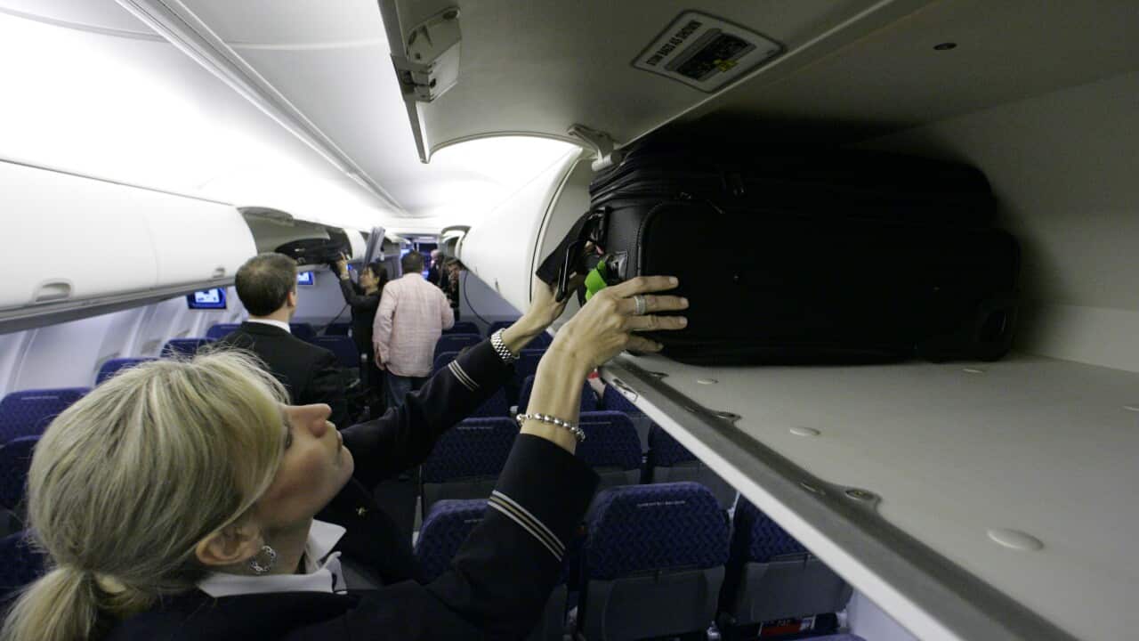 Global airlines on Tuesday, June 9, 2015 announced new guidelines that would shrink the size of bags allowed on planes. (AP Photo/Donna McWilliam, File)