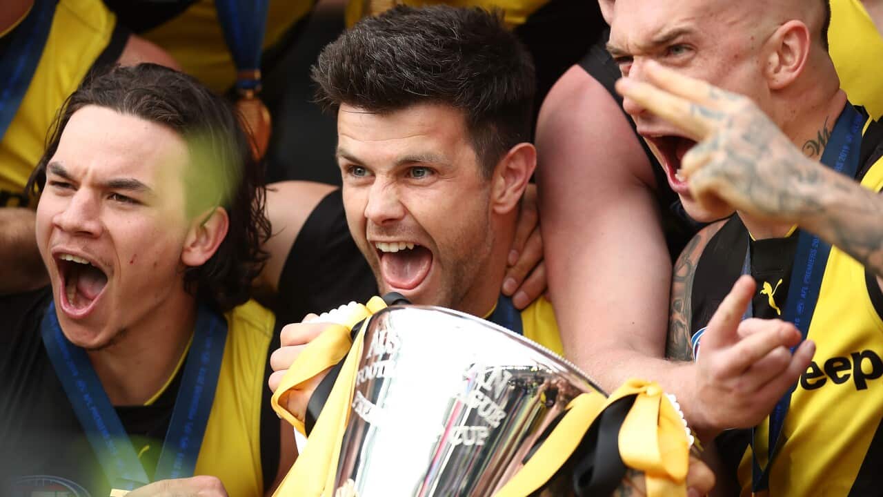 AFL players celebrate victory