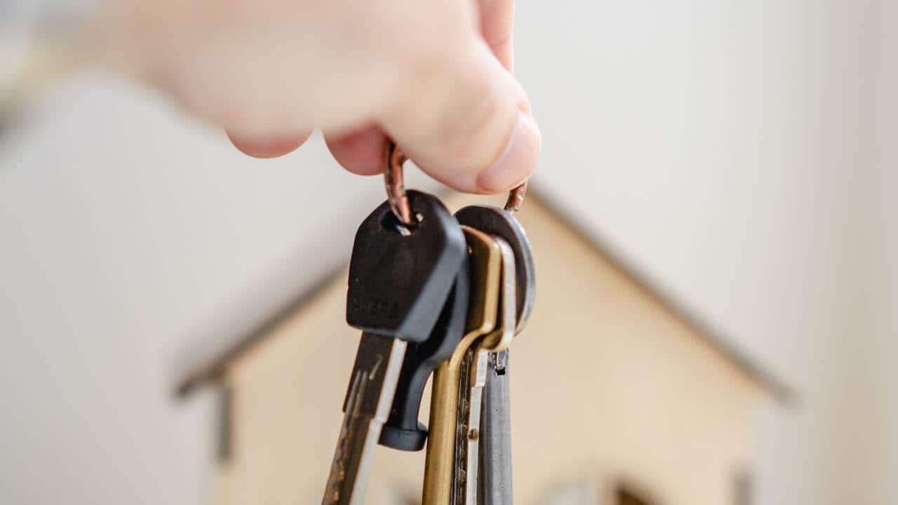 Person with keys for real estate