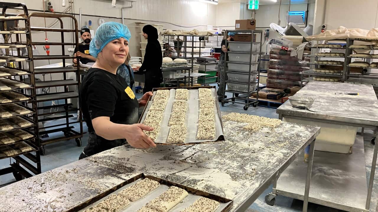 Samia prepares dough in the bakery