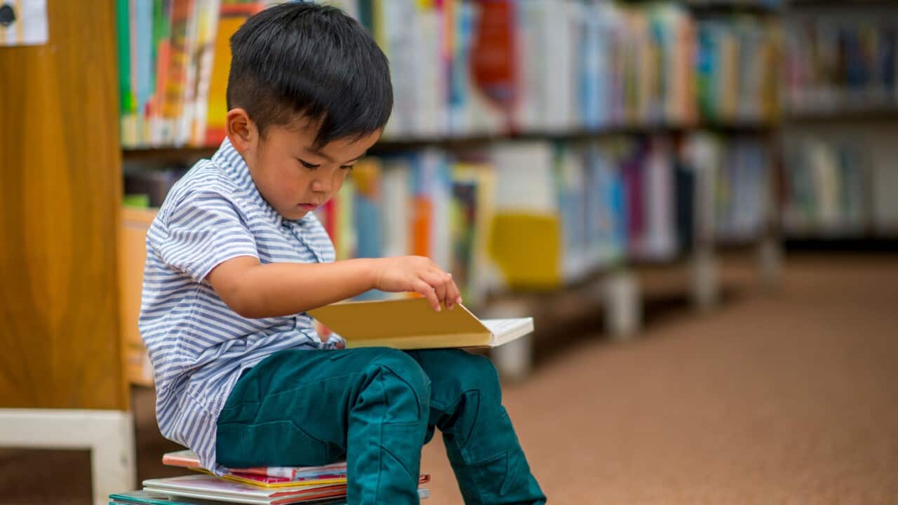 A child reading in a library