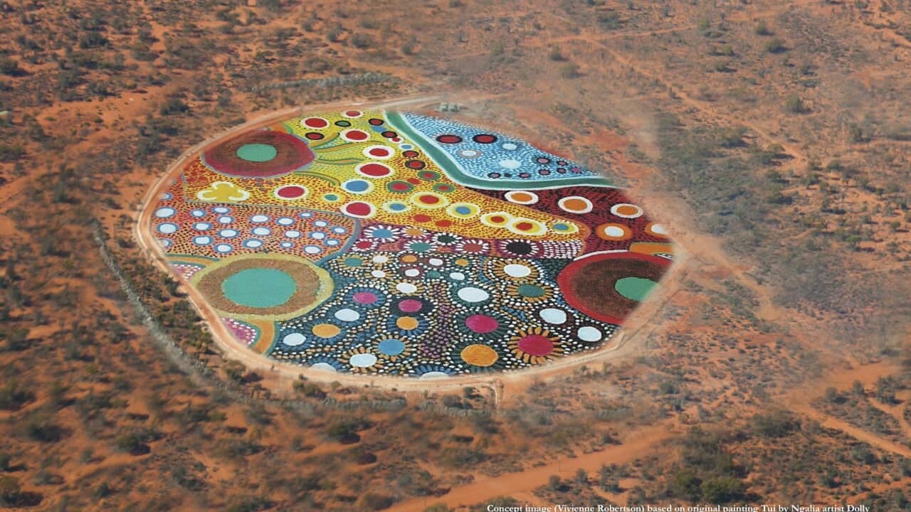 an artist's impression of an aerial shot of a vast multi coloured dot artwork covering a stretch of outback country, where a mine hole once was.
