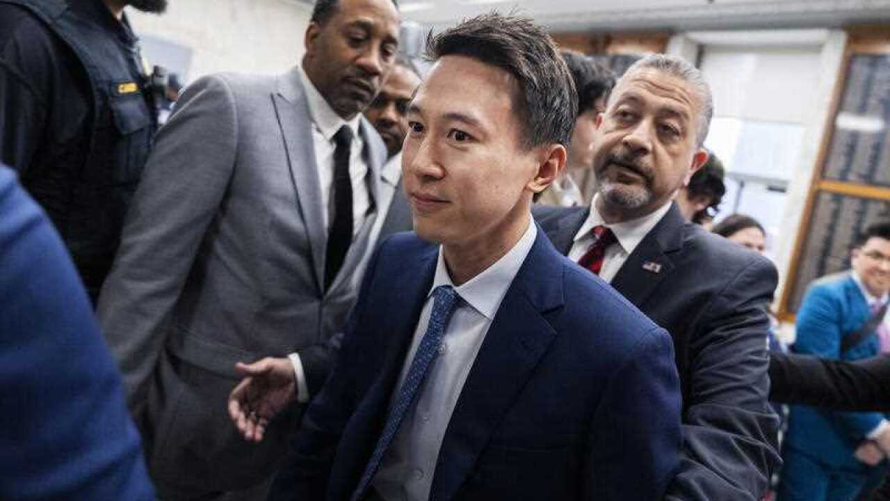 TikTok CEO Shou Zi Chew in a crowded room.