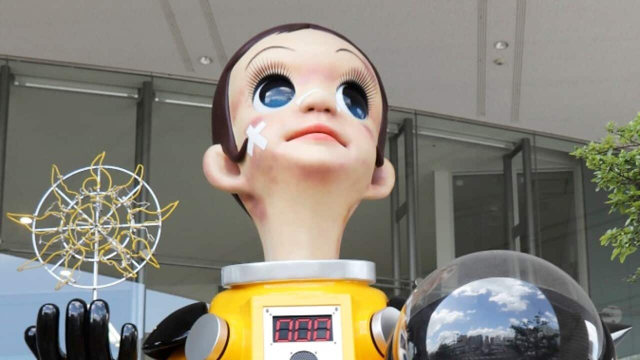 The artwork 'Sun Child' by Japanese artist Kenji Yanobe is displayed before a cultural facility in Fukushima city, Japan, 14 August 2018. 
