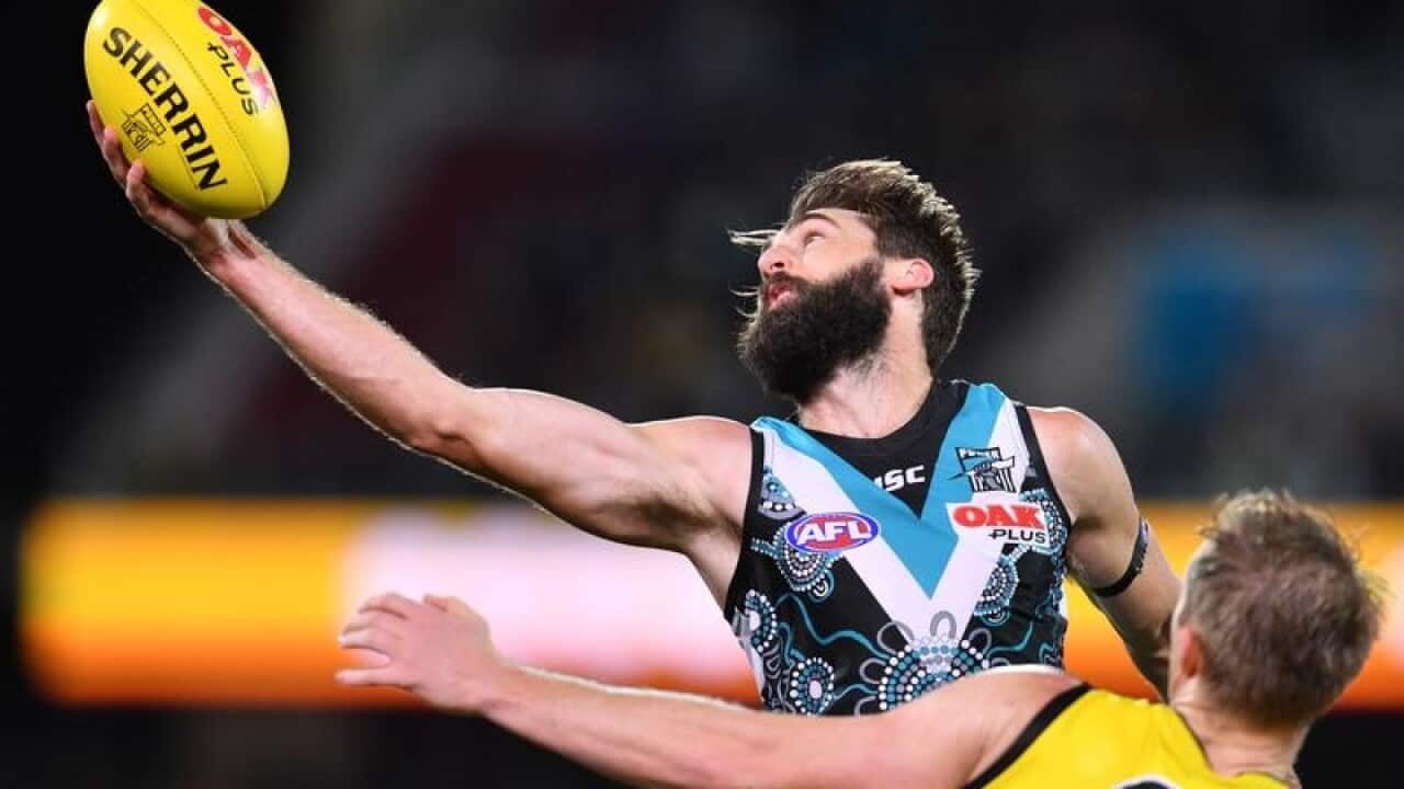 Justin Westhoff of the Power marks the ball.