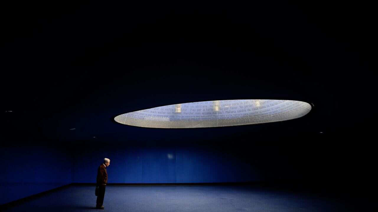 A man stands at the Atocha railway station memorial for the victims of the Madrid train bombings in Madrid AAP.jpg