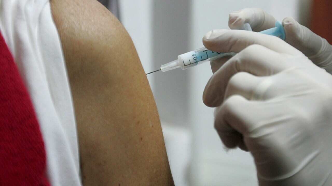 A man is vaccinated