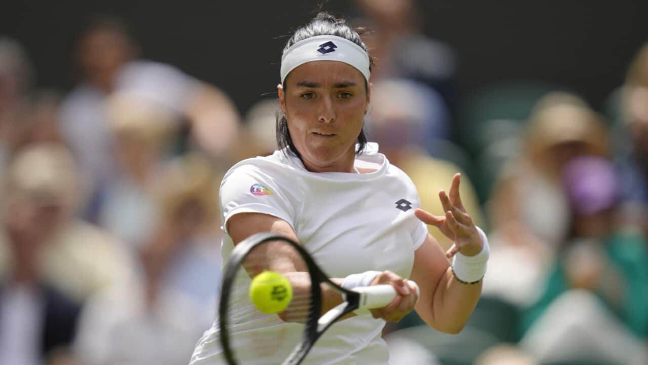 Woman playing tennis.