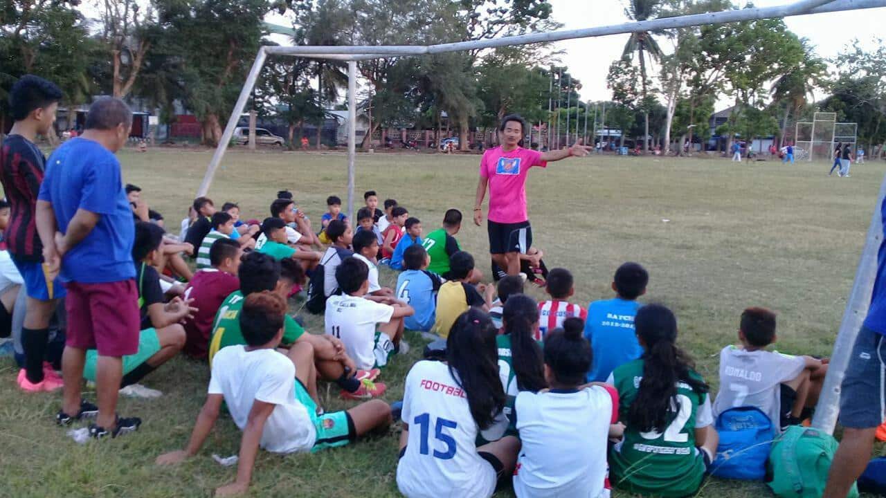 Elmer Bedia (standing in pink shirt)
