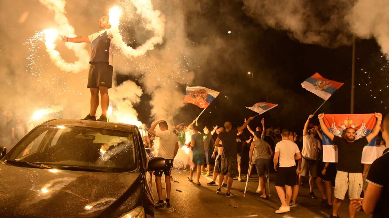 Supporters of opposition groups celebrate after poll closed in Montenegro's parliamentary elections in Podgorica, Montenegro, August 31, 2020.