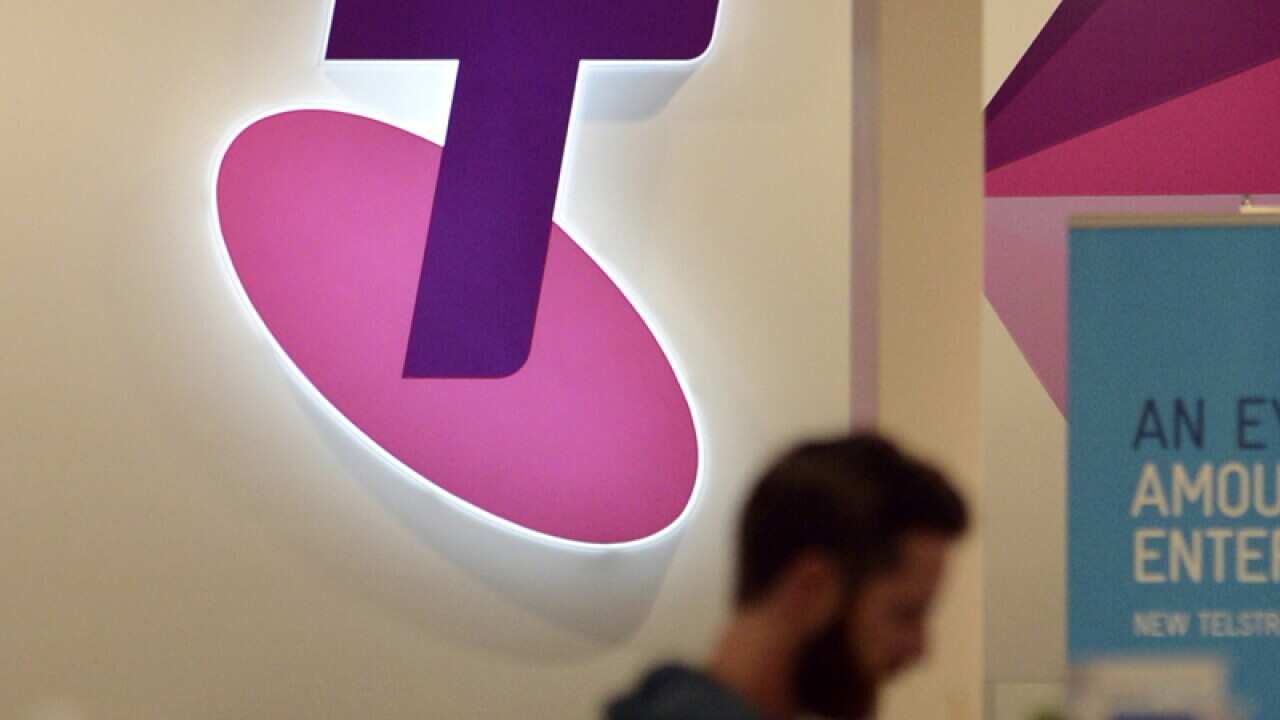 The Telstra symbol in a Telstra shop