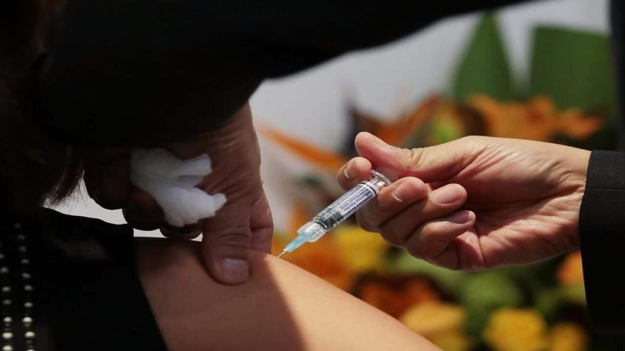 A member of the public receives a flu shot.