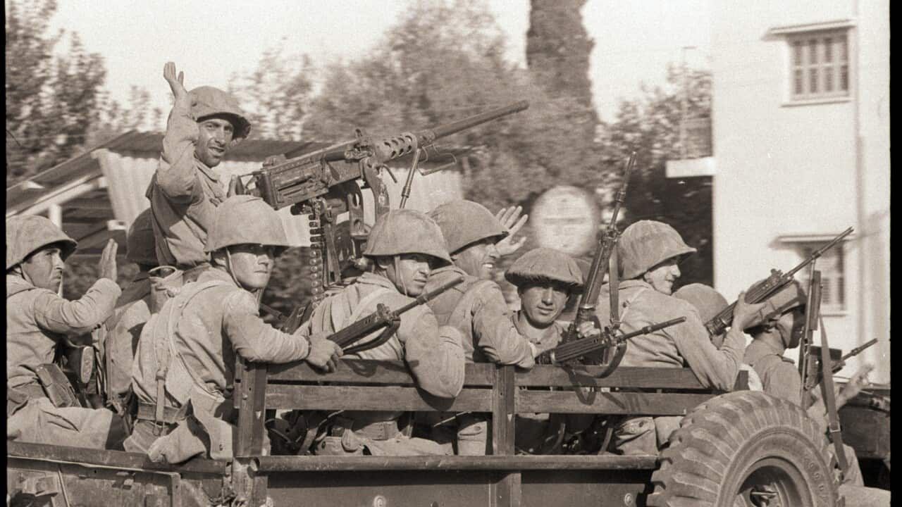 Armed Turkish Troops Wave and Smile