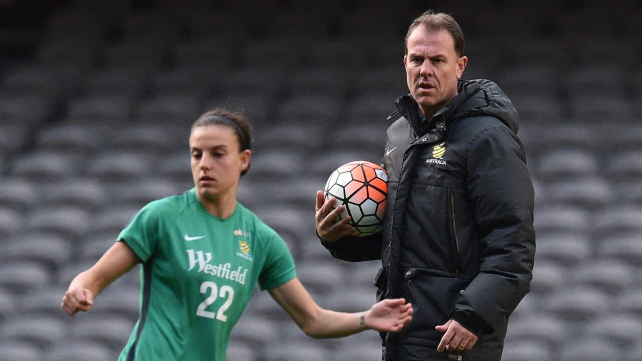 Coach Alen Stajcic (right) is seen at a Westfield Matildas training session at Etihad Stadium in Melbourne, Monday, June 6, 2016. (AAP Image/Julian Smith) NO ARCHIVING
