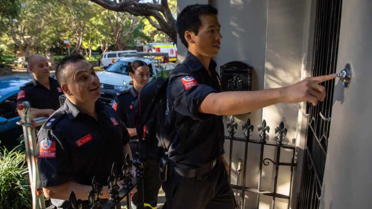 Firefighters in Redfern, Sydney, spreading the word about fire safety.
