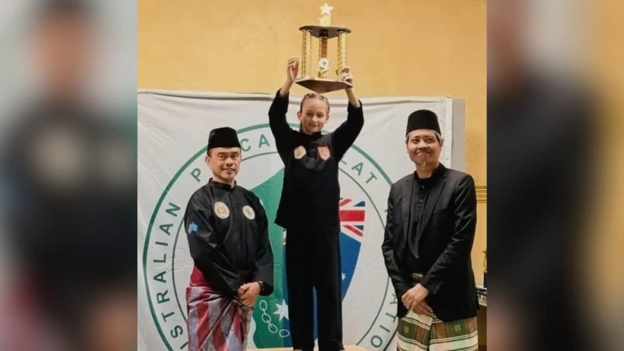 Kaila Lloyd holds her trophy after winning the female pre-teen tanding division and Best Female Fighter award at the 2026 Victorian Pencak Silat Championship in Melbourne.
